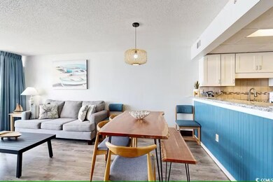 Dining space with hardwood / wood-style floors, si