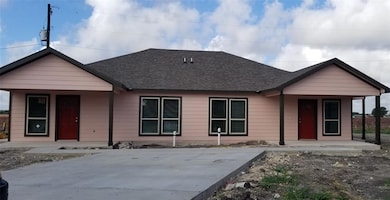 Ranch-style house featuring roof with shingles an