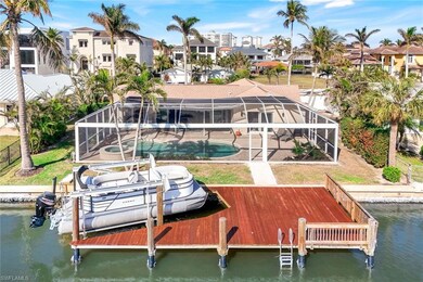 View of dock with a lanai and a water view