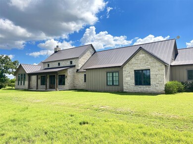 Back of house with metal roof, a standing seam ro