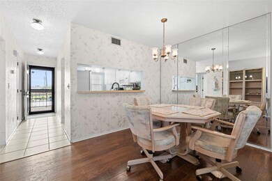 Large dining room which can easily accommodate a large group.  Entertaining is a breeze with the kitchen pass-through!