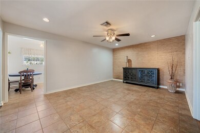 LIVING ROOM WITH A VIEW OF KITCHEN