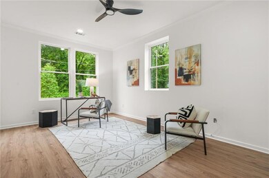 Downstairs bedroom featuring LVP flooring, baseboards, recessed lighting