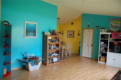 Sliding glass doors to the lanai and a fireplace a