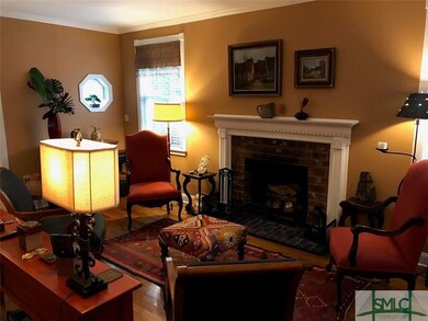 Inviting living room with wood-burning fireplace.