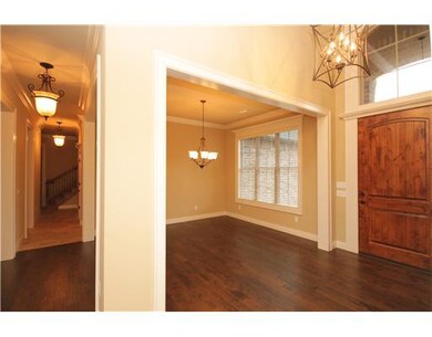 Other. Entry features wood door, hardwood floors a