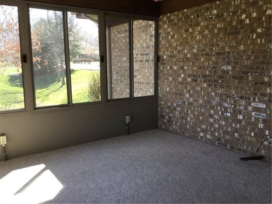 The three seasons room has 2 walls of windows to e