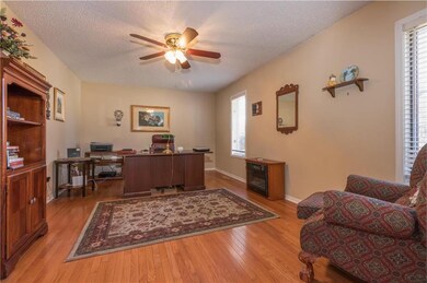 large office w/ French doors off of main entry to 