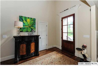 Open and airy two-story foyer with hardwood floori