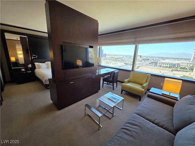 Living room featuring light carpet