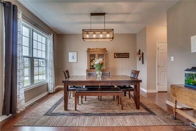Large dining room with beautiful light fixture