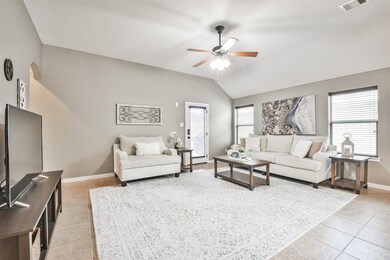 ndulge in the beauty and versatility of this family room, where the view of the backyard, tile flooring, and high ceilings combine to create a truly remarkable living space.