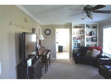 Great room with built-in bookshelves.