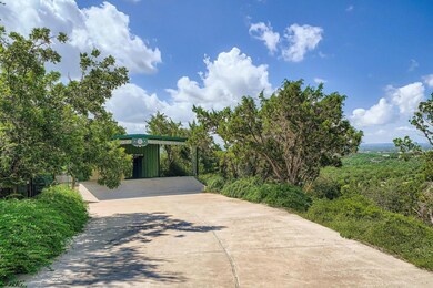 View of front facade with driveway and board and 