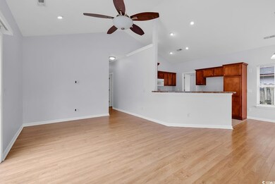 Unfurnished living room featuring ceiling fan, light wood-style floors, recessed lighting, and high vaulted ceiling