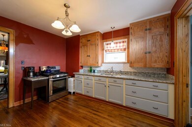What do I say about this beautiful kitchen.  It features hardwood floors, granite counter tops, new sink and faucet, subway tile back splash.  This is a dream kitchen waiting for the chef in your family.