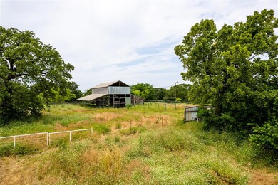View of yard with an outdoor structure and a rural