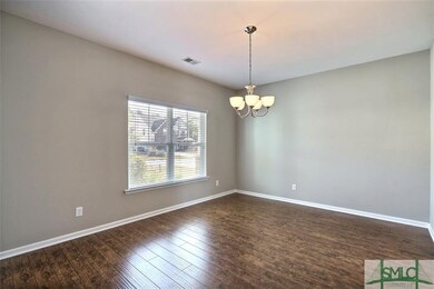 Formal dining room greets you as you enter the hom