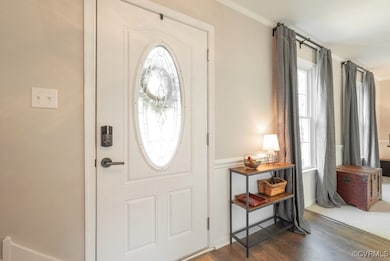 Entrance foyer featuring wood finished floors and
