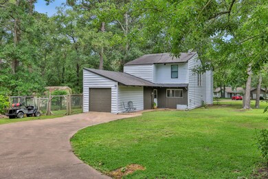 Front elevation with a private driveway, attached
