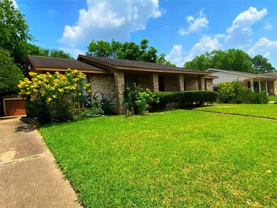 Another angle of the front of this lovely home with a portion of the driveway