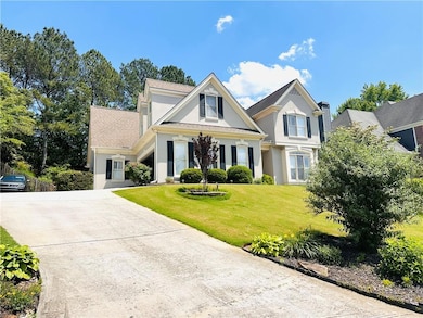 View of front facade featuring concrete driveway, 