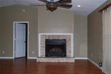 Wood burning fireplace in the family room.