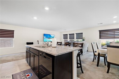Kitchen with light colored carpet, dishwasher, lig