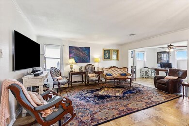 Very open living room, flows into kitchen, office