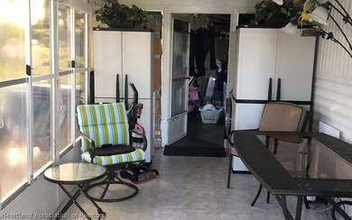Enclosed porch with Shed.