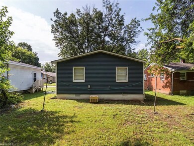 Flat open backyard. Both bedrooms overlook backyard.