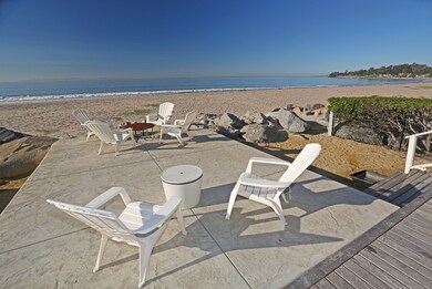 Teak deck extends to concrete terrace.