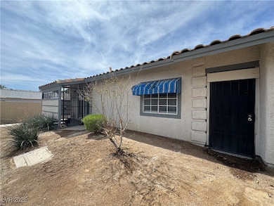 Property entrance with stucco siding