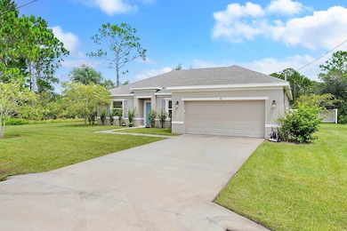 Ranch-style house featuring stucco siding, a front lawn, driveway, a shingled roof, and an attached garage