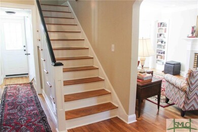 View of the living room and stairs from the front 
