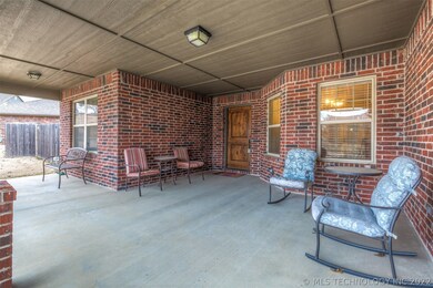Large covered front porch with wood plank ceiling