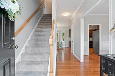 Entry boasts hardwood floors and the formal dining