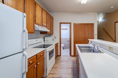 The kitchen has a half bath, as well as a HUGE pantry closet (to the right of the bathroom door.)