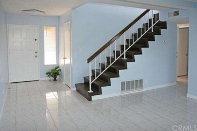 Entry Door & Hardwood Staircase