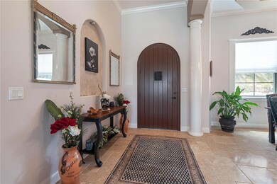 Front Door to Foyer & High Ceilings w/Crown Molding