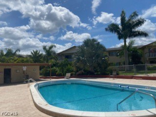 Community pool with a patio area
