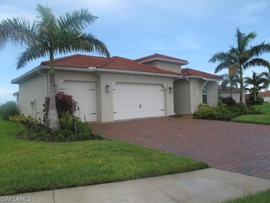 Mediterranean / spanish home with a front yard and