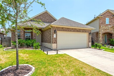Not only is this yard well-maintained but your neighbor's property is beautiful as well. This double wide driveway and 2 car garage allows for plenty of room for your family to park while visiting.
