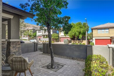 View of patio featuring a residential view, a fenced front yard, and a gate
