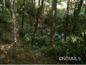 Sits above rushing stream