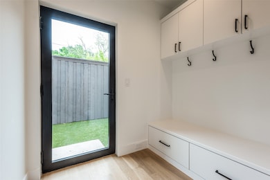 Mudroom with light wood finished floors