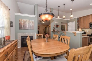 Dining Room with See-thru gas log Fireplace and op