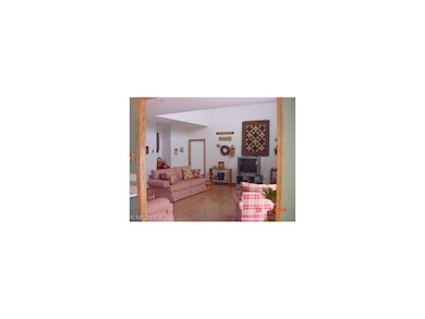 Spacious Great Room with hardwood floors and ample