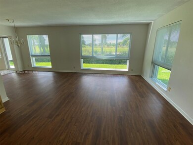 Very spacious living room perfect for large size furniture, great light and views to the golf course!