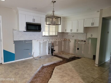 Kitchen. Removed cabinets on premises.